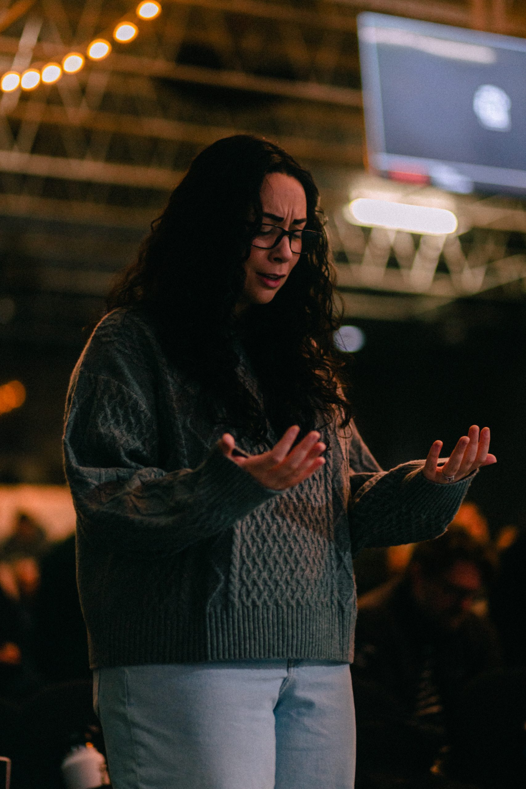 Hands cradling golden light in prayer